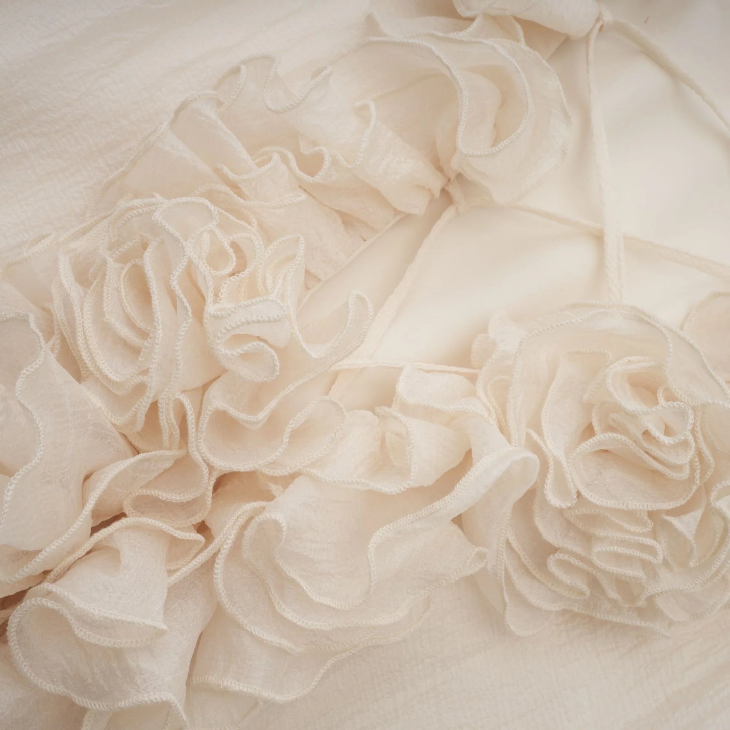Close-up of beige ruffled fabric texture