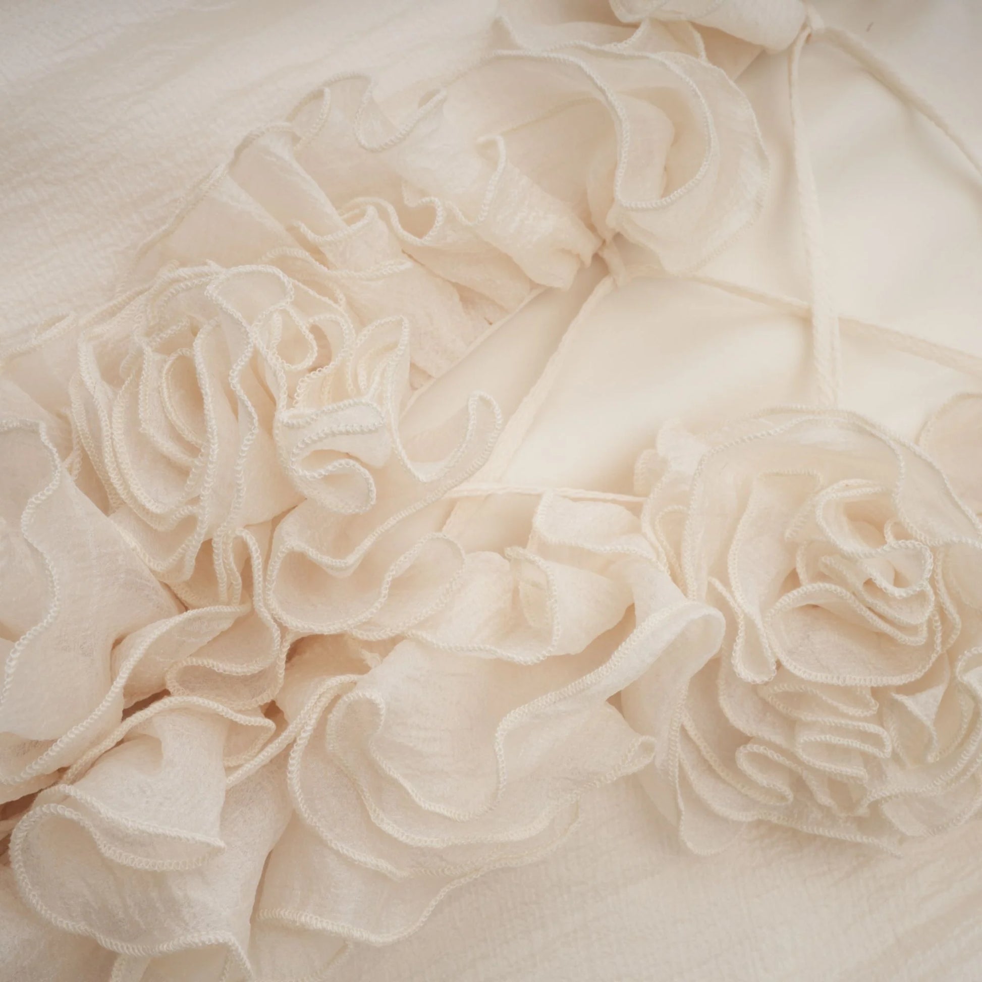 Close-up of beige ruffled fabric texture