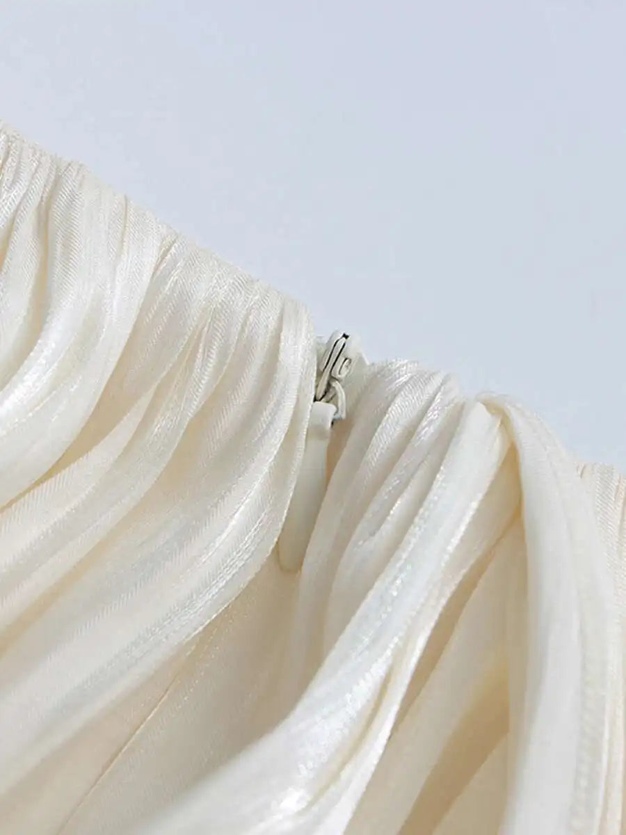Close-up of a beige fabric with a zipper on a white background
