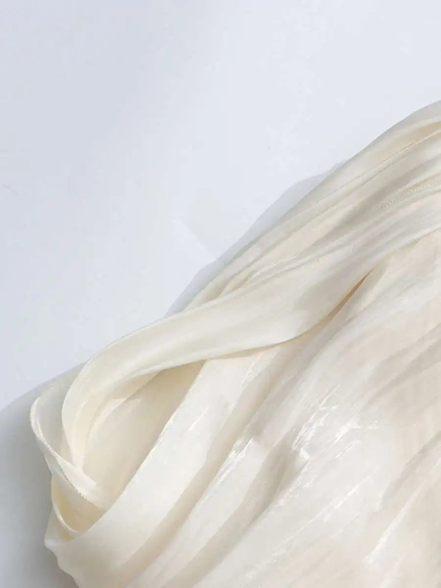 Close-up of light beige fabric on a white background